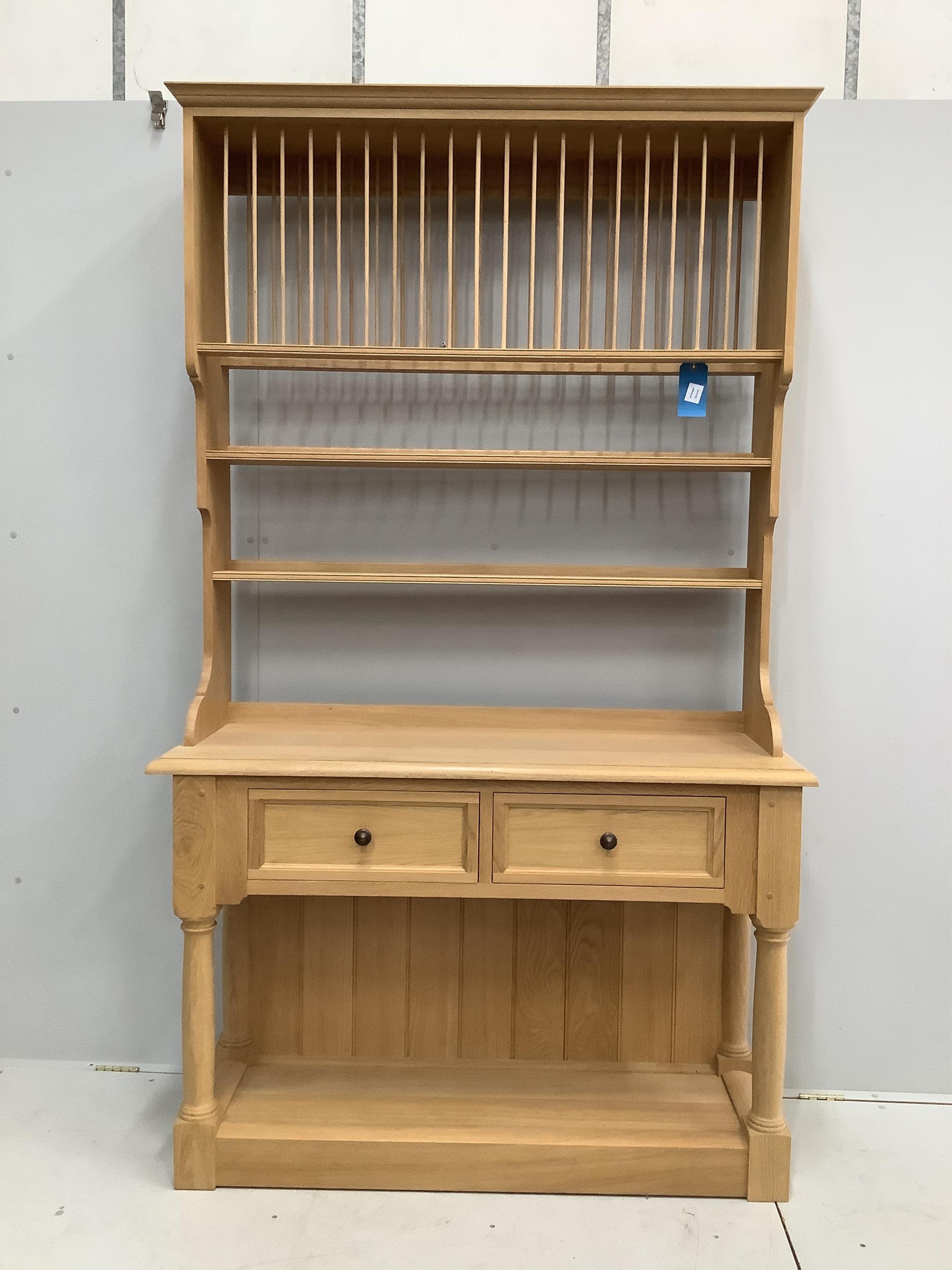 A modern bespoke light oak dresser, width 135cm, depth 50cm, height 227cm. Condition - good
